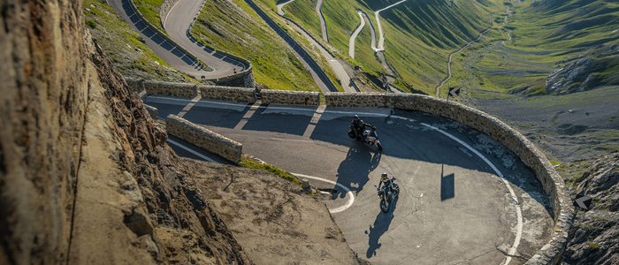 Moto Fun Anna *** © Moppetfoto.de Motorcycles riding on a winding mountain road with steep slopes