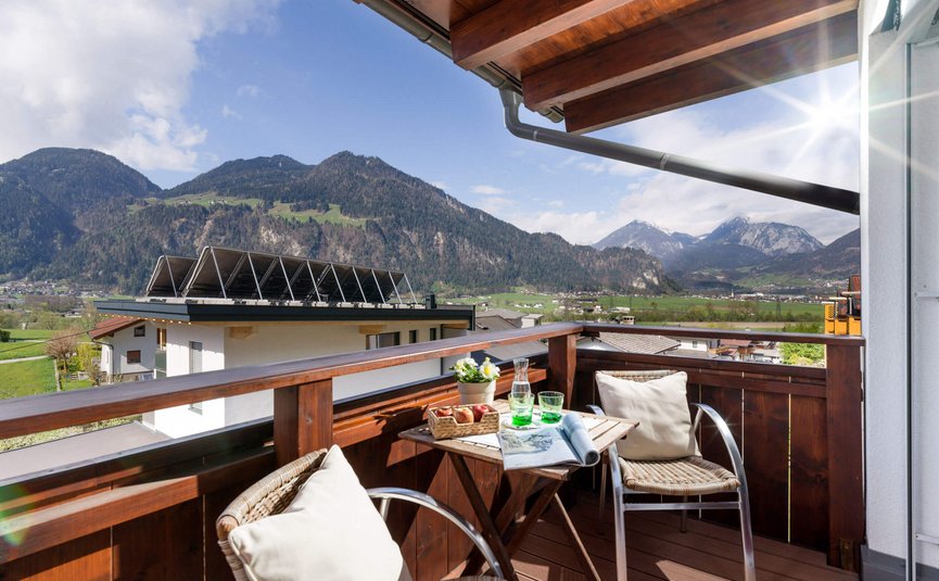 Hotel Sonnleiten *** Balcony with chairs, table, and mountain view on a sunny day
