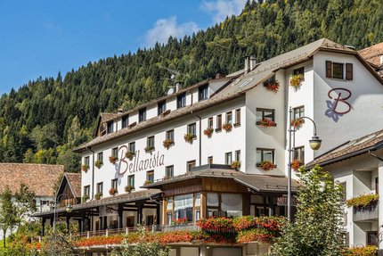 Hotel Ristorante Bellavista © Hotel Ristorante Bellavista Bellavista hotel with flowers and forested mountain backdrop
