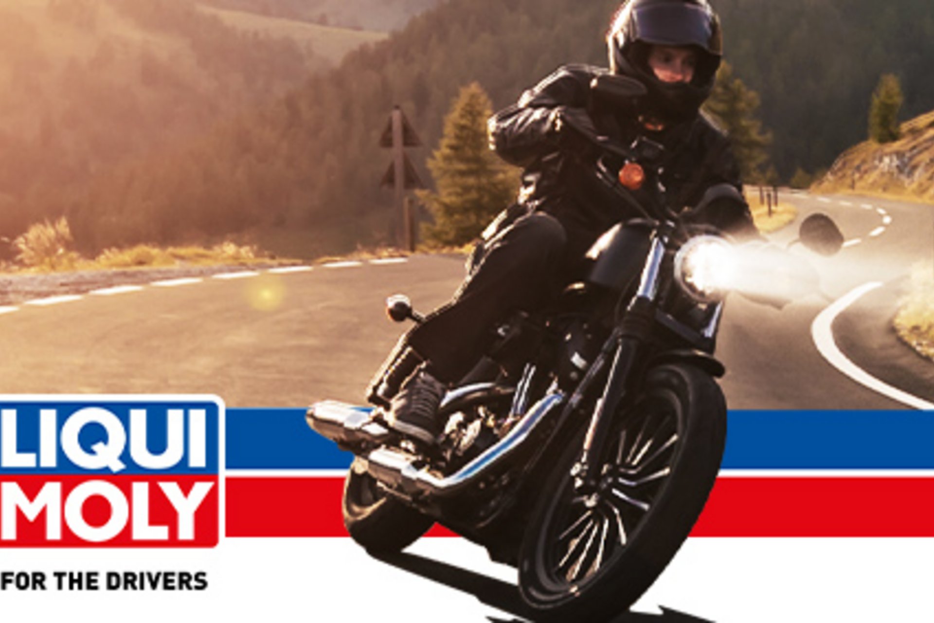 Motorbike holiday © Liqui Moly Motorcyclist on winding mountain road with Liqui Moly logo